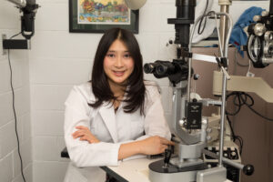 Dr. Rae Huang, optometrist, in her Newton exam room